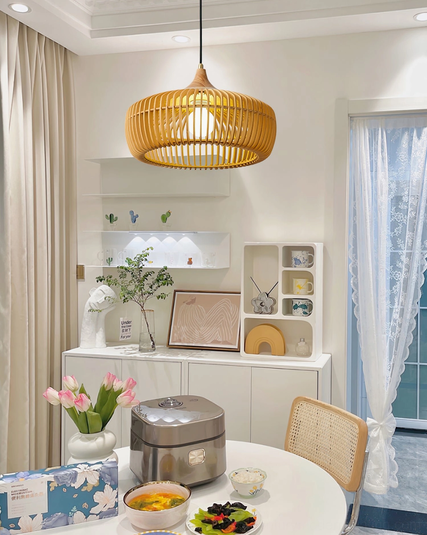 Slatted Pimms wooden pendant lamp in modern home dining room creating cozy warm ambient lighting with contemporary decor