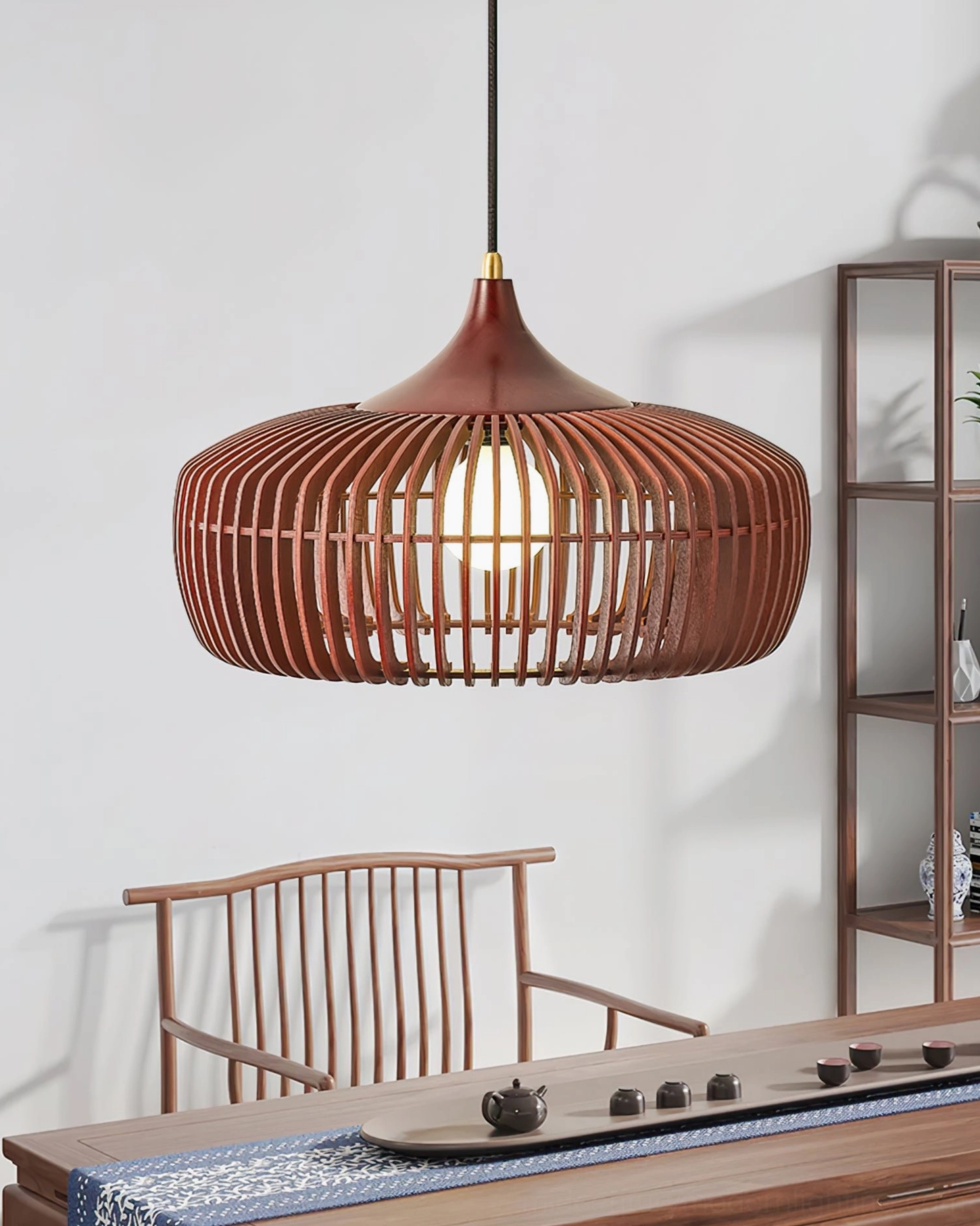 Pimms pendant lamp in dark reddish-brown walnut color finish suspended in traditional tea room with oriental rustic aesthetic