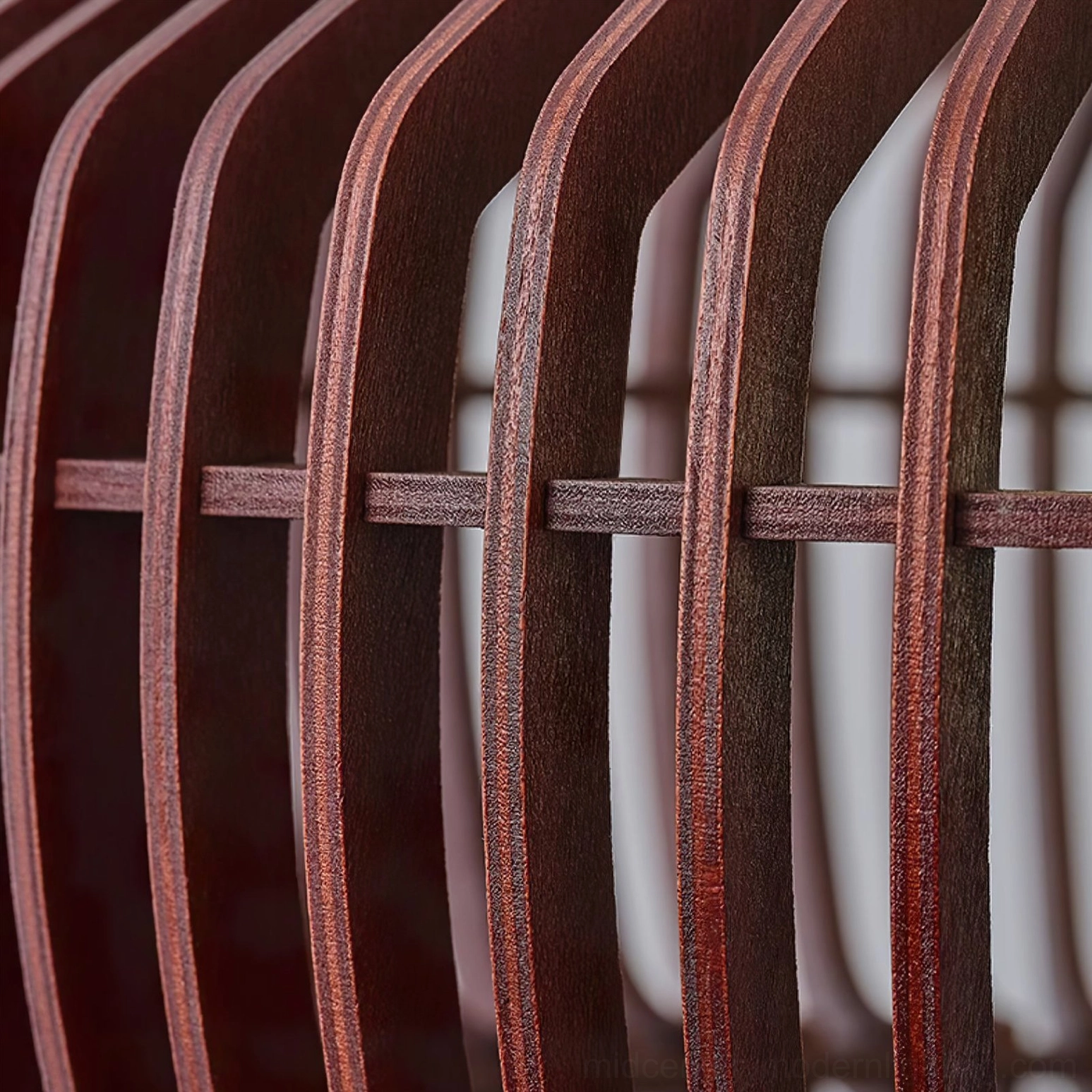 Close-up macro detail of Pimms wooden slats showing curved strips and rich dark brown wood grain texture on dark background