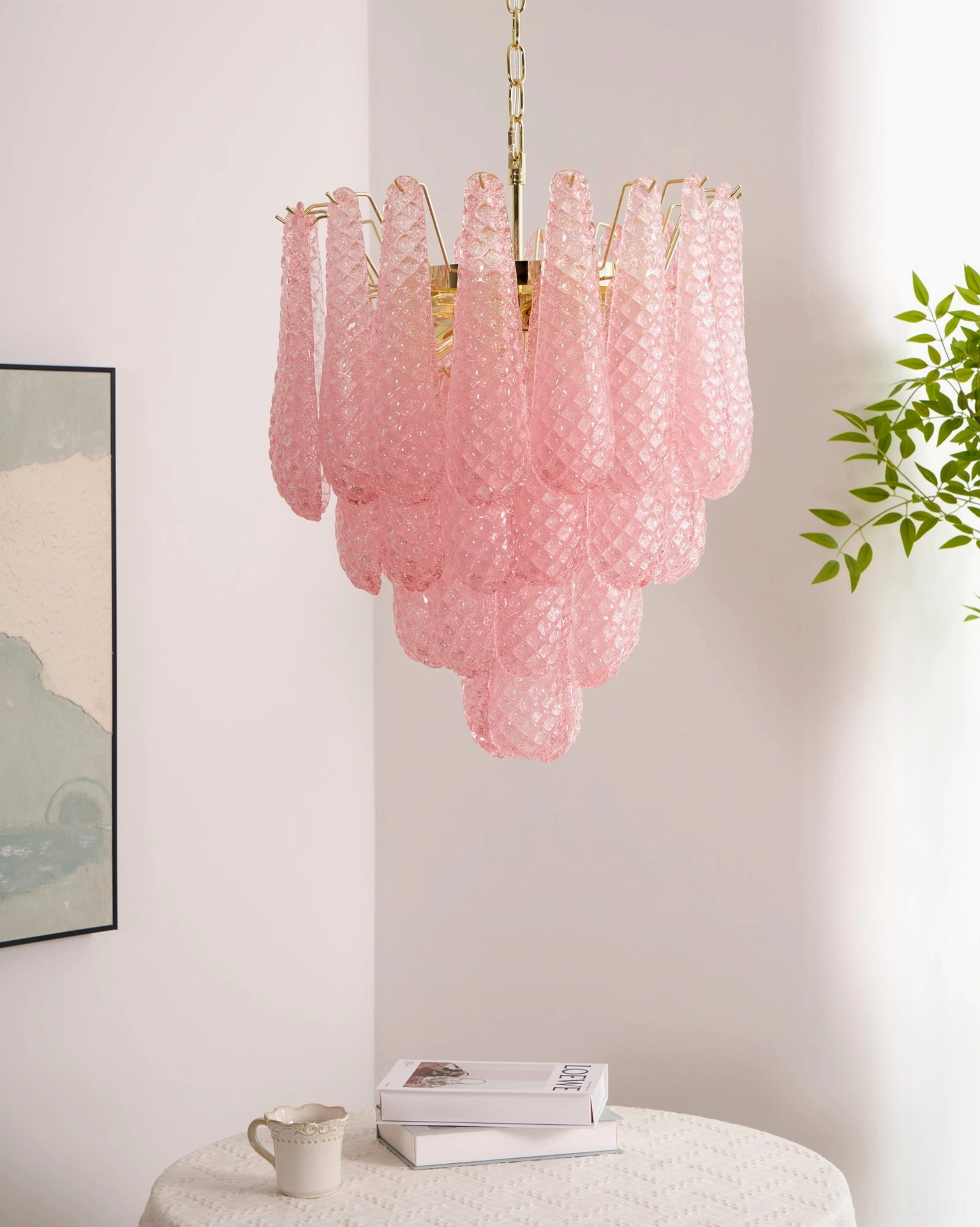 Pink glass teardrop chandelier artistic composition highlighting glass layers and light refraction