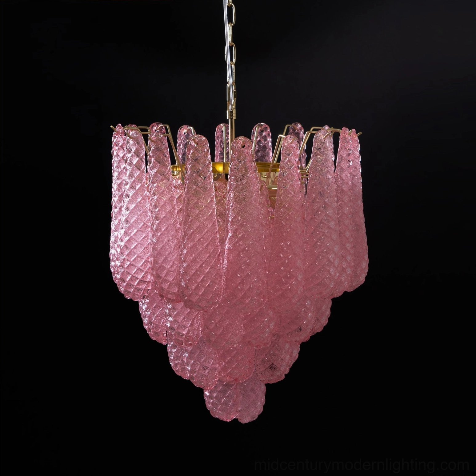 Pink Murano-style glass chandelier with warm lighting showing glass diffusion and ambiance