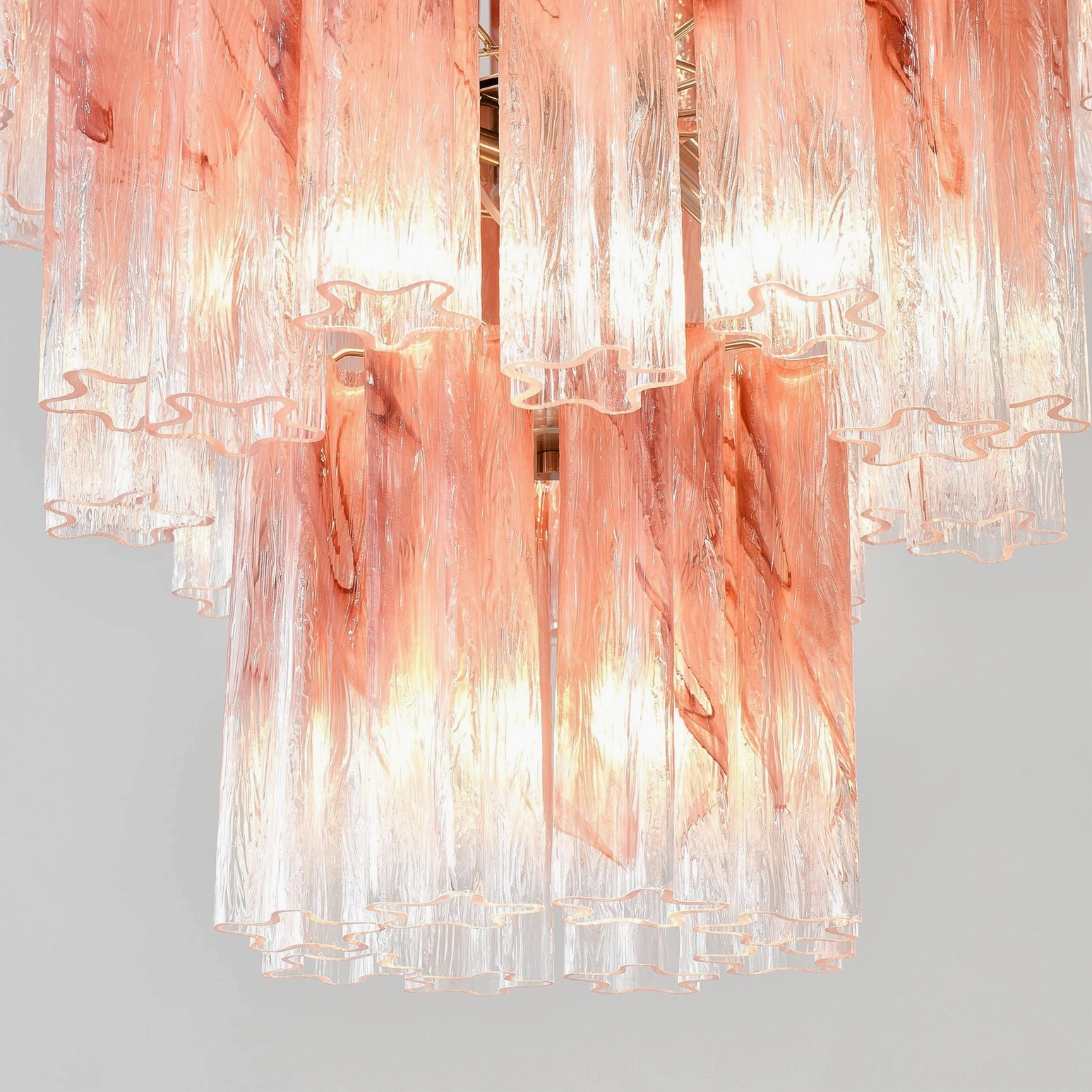 Angled view of pink Murano tube chandelier demonstrating three-dimensional glass tube positioning