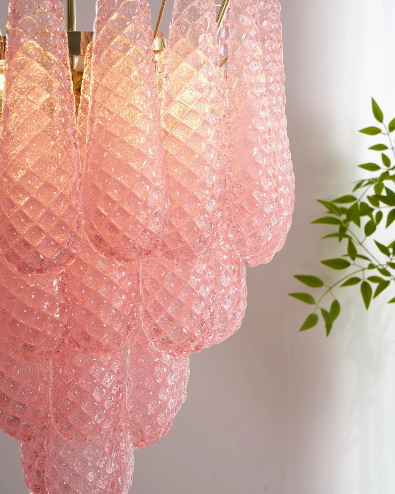 Pink Murano-style glass chandelier in interior setting displaying room illumination and ambiance