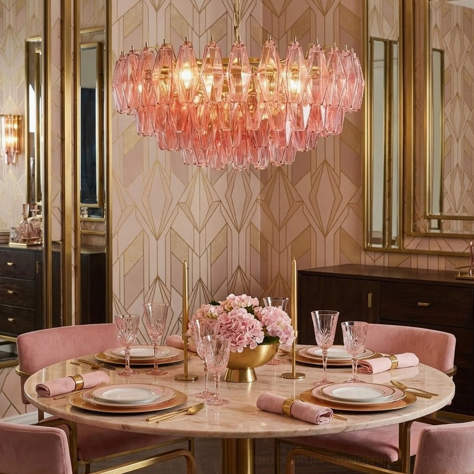 Glowing pink polygon chandelier in art deco styled dining space with geometric wallpaper and dark wood sideboard