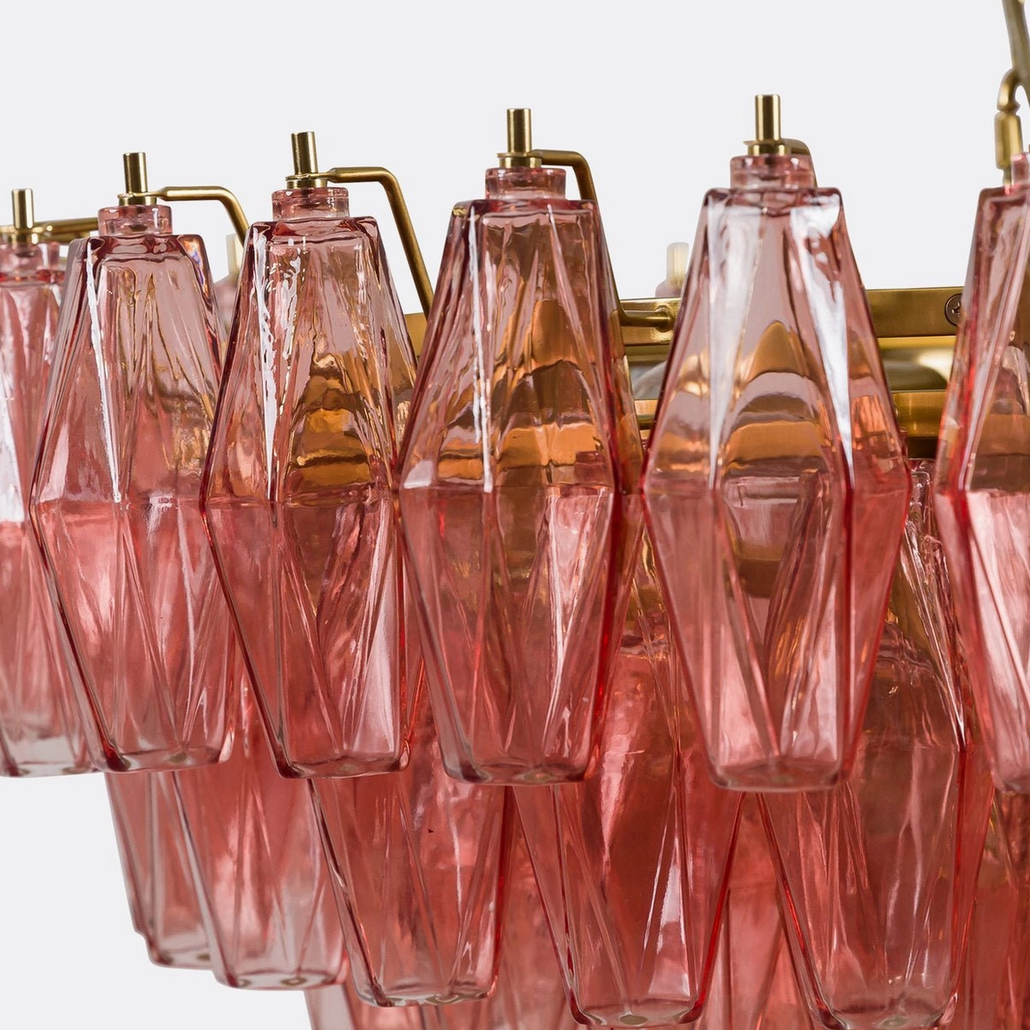 Pink polygon glass chandelier with gold accents demonstrating mid-century modern geometric design aesthetic