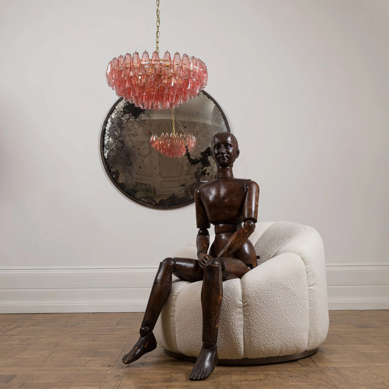 Pink polygon chandelier side profile view showing layered glass prism cascade and suspension chain