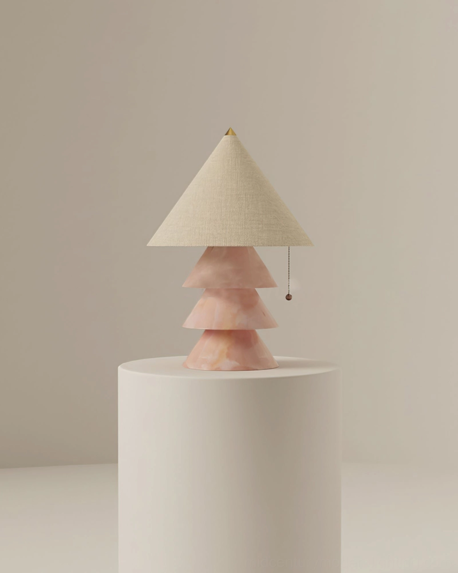 Pink marble pyramid lamp illuminated showing warm light diffusion through fabric shade