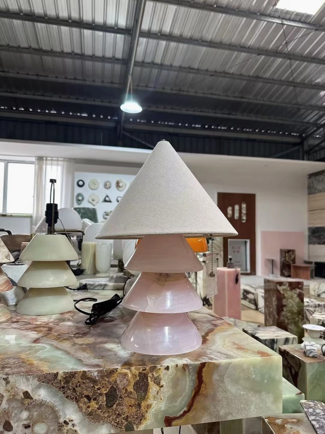Pink marble pyramid lamp base detail showing natural stone veining and texture