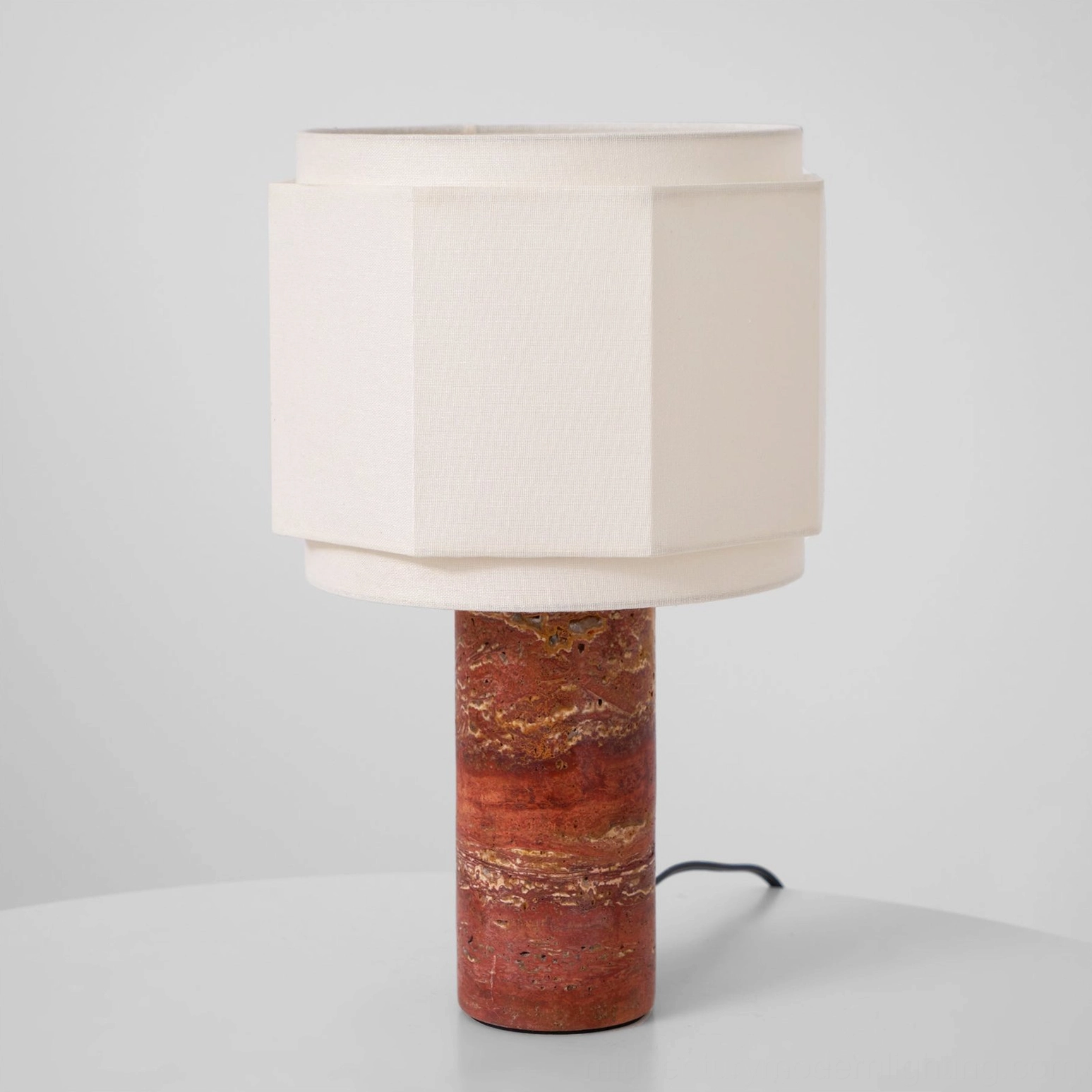 Full perspective view of Pipito travertine table lamp showing proportions and geometric octagonal shade