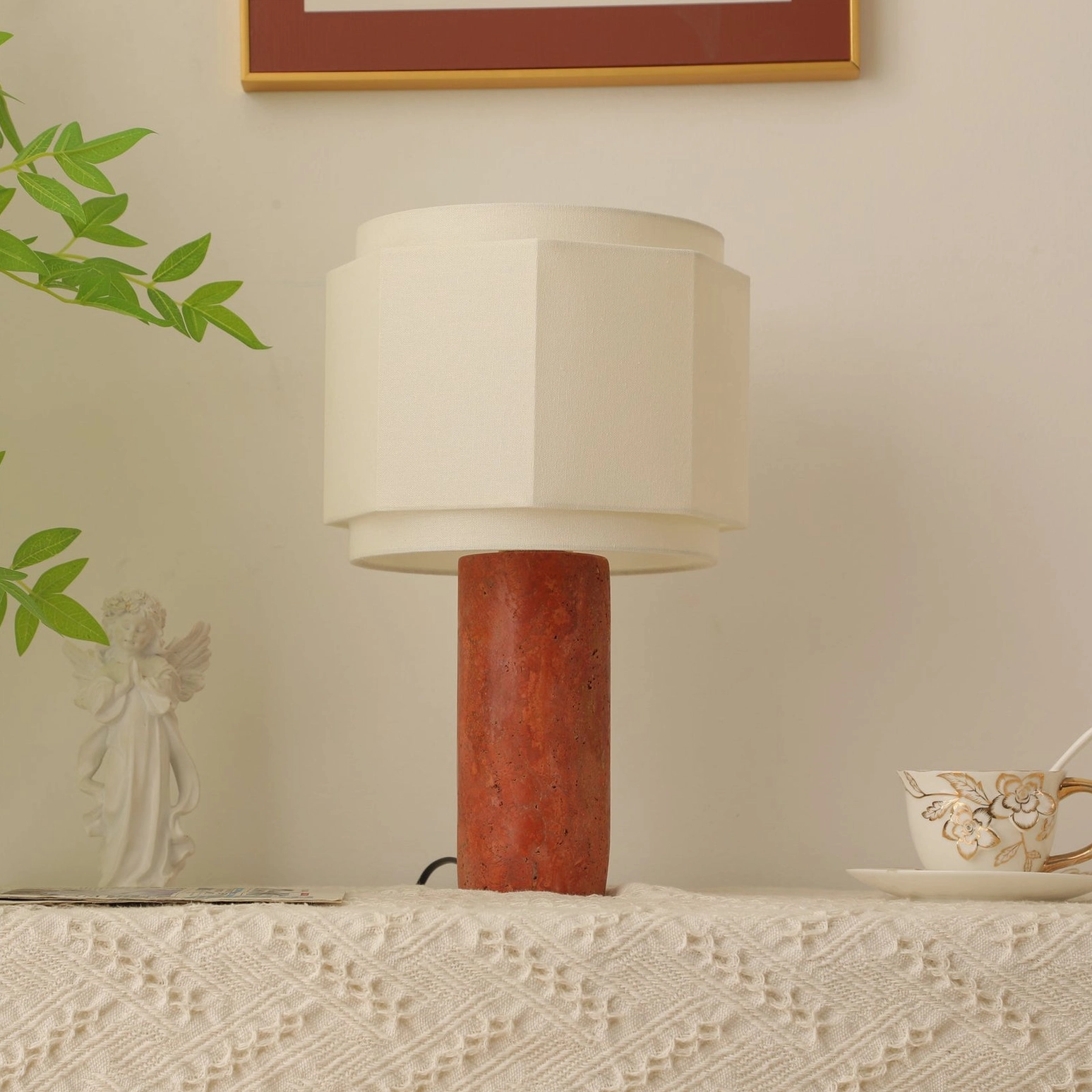 Pipito travertine stone lamp base showing natural veining and earthy red-brown mineral tones
