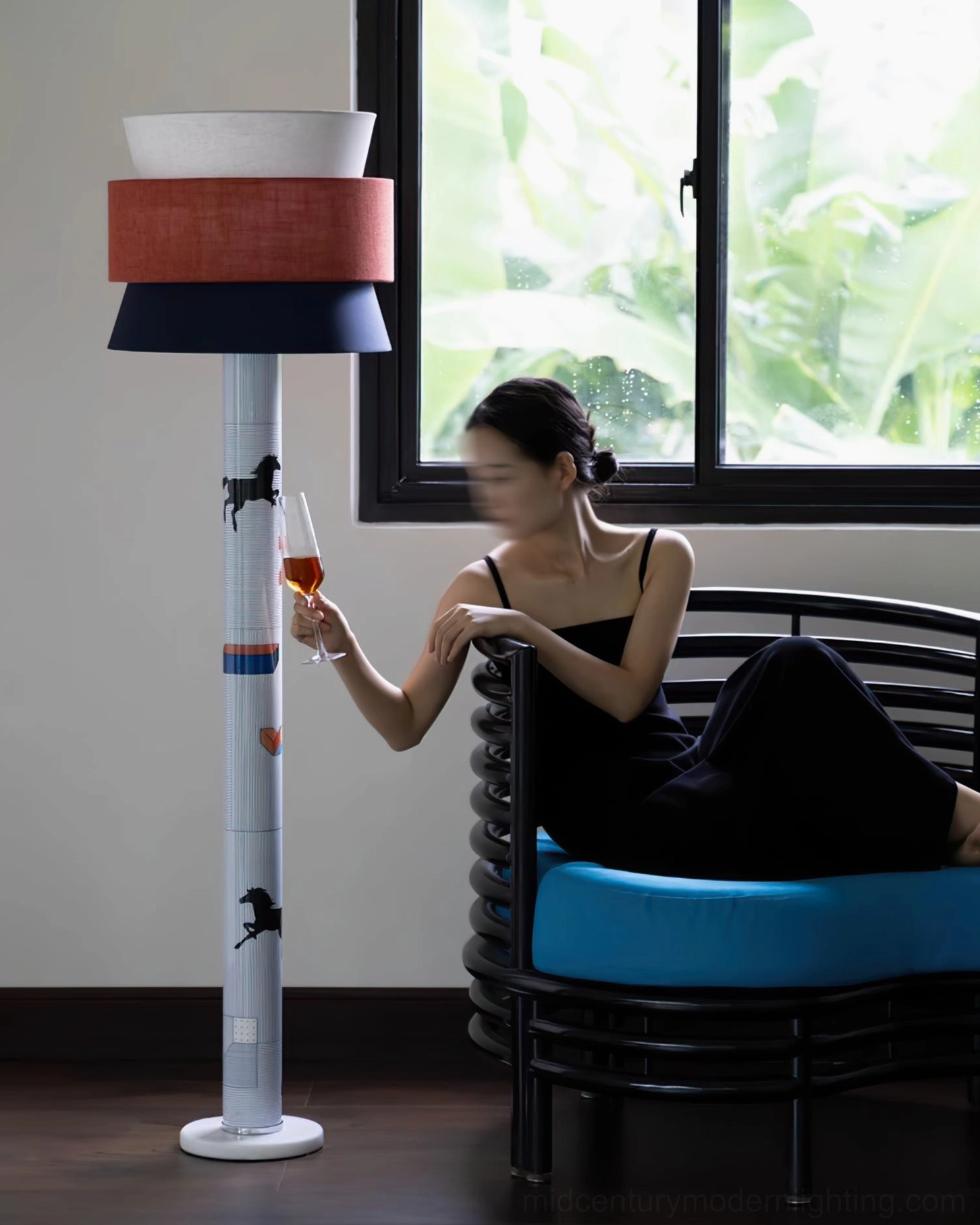 Mid-century modern standing light beside blue lounge chair by large window, warm ambient lighting scene