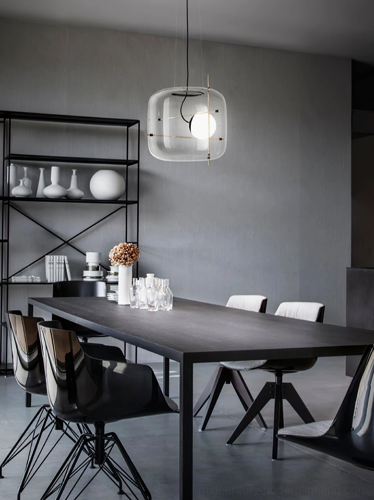 Plot modern glass pendant lamp showing architectural black metal frame and geometric cubic form