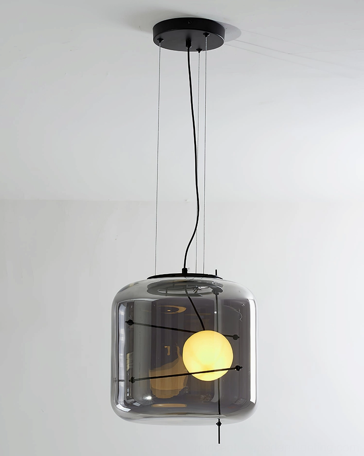 Plot pendant lamp in contemporary interior demonstrating versatile styling and light diffusion