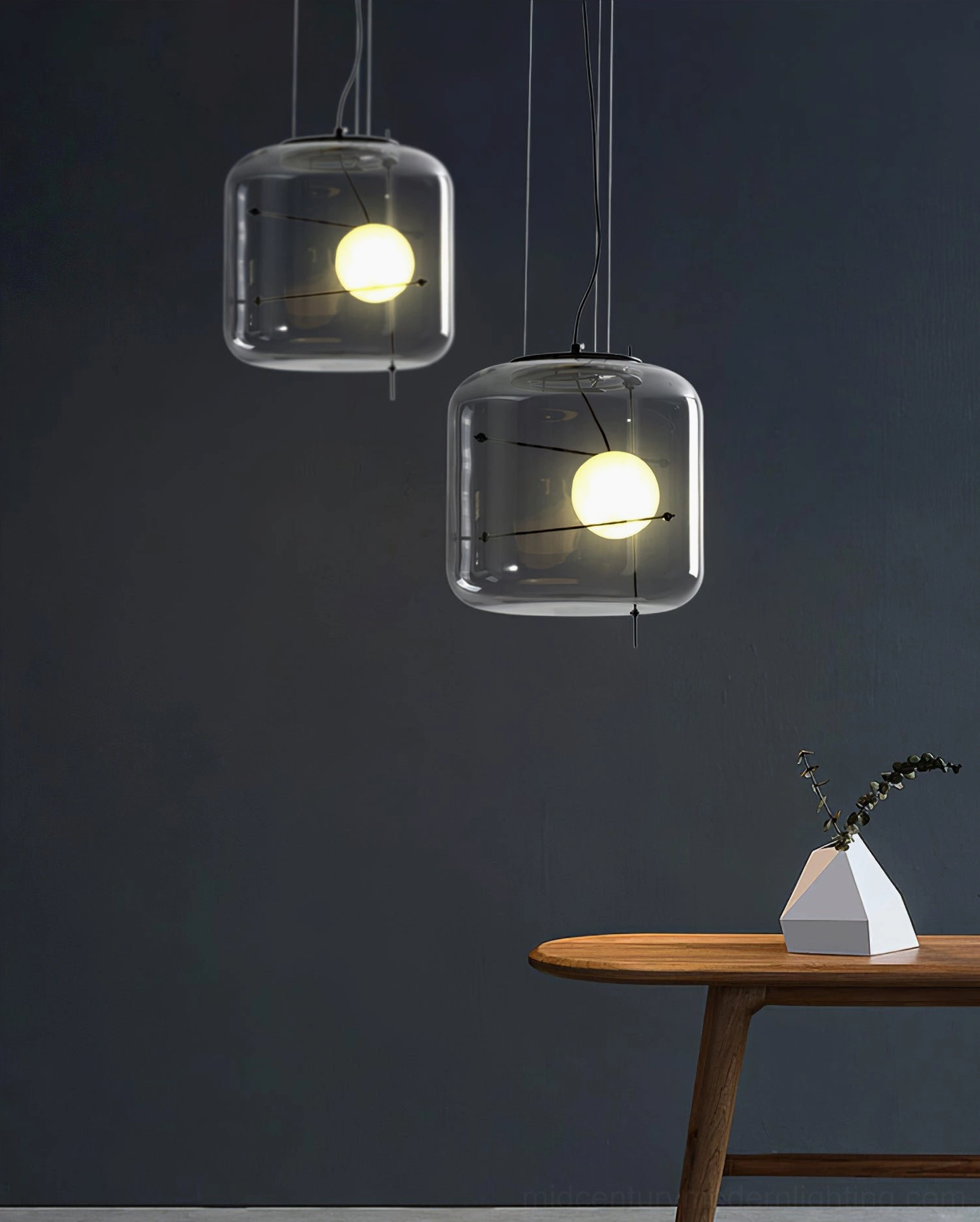 Plot suspension lamp with G9 bulb base compatibility in minimalist modern setting
