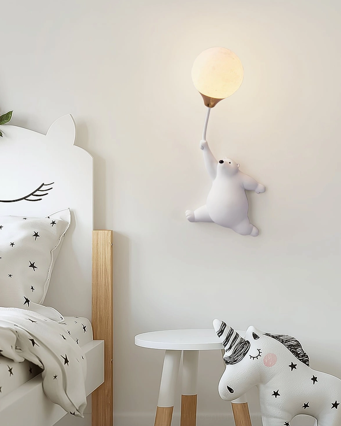 White polar bear balloon lamp in playful kids bedroom with unicorn decor - whimsical children's wall sconce