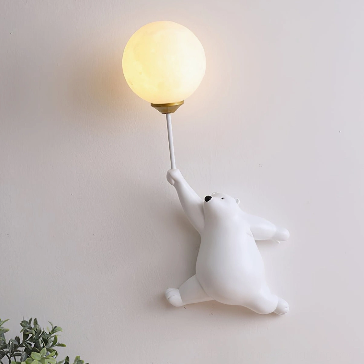 Pastel pink polar bear balloon lamp illuminated in neutral tone bedroom - soft warm ambient wall light