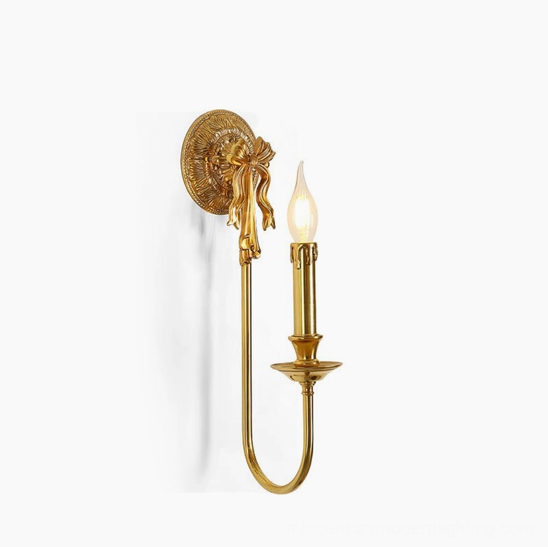 Polished brass bow wall sconce with E14 bulb base and elegant minimalist silhouette