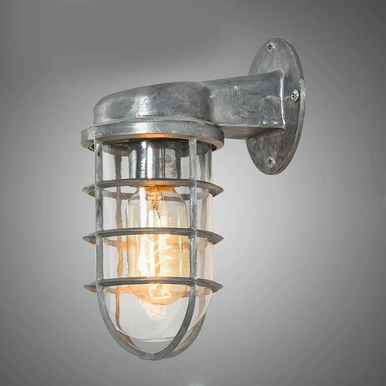 Brushed iron gray maritime cage wall lamp with glass shade detail on neutral background