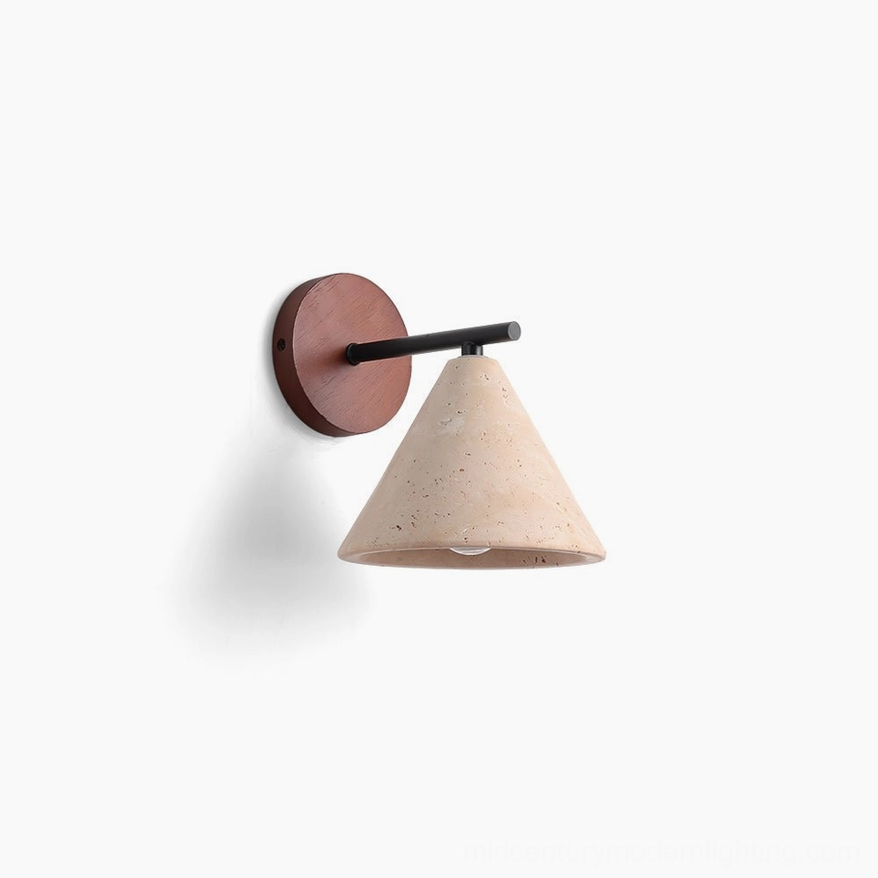 Possio travertine wall light with cone silhouette, showing porous stone texture and walnut wood accent against white studio background