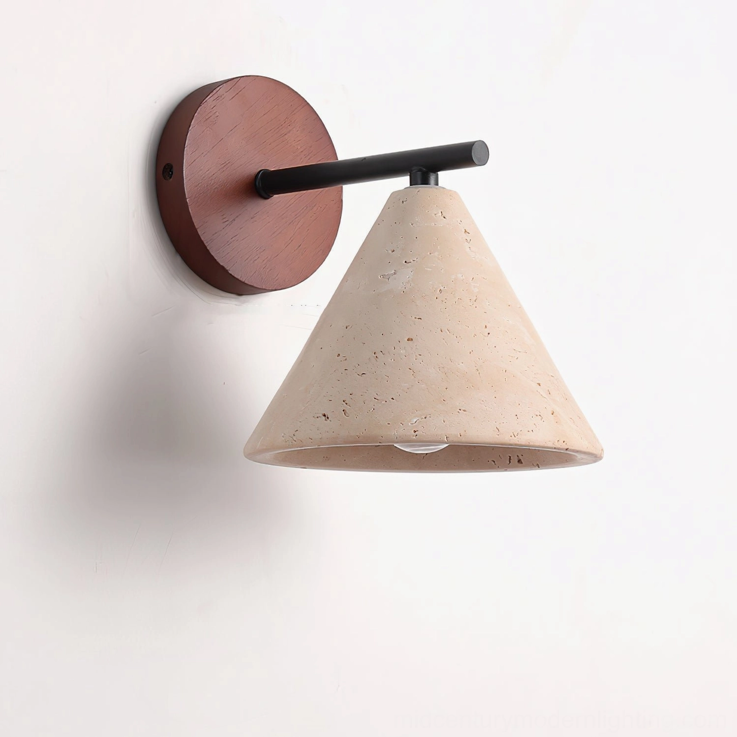 Possio wall light close-up detail shot showing travertine porous texture, walnut wood accent, and metal mounting hardware