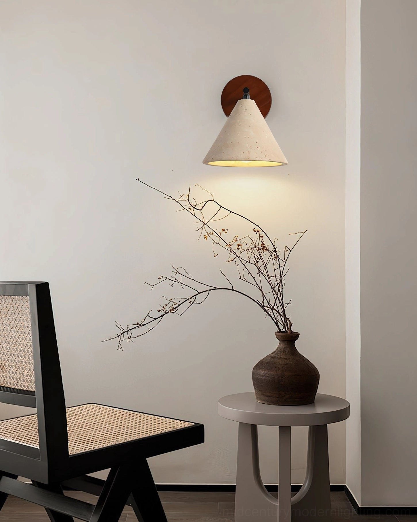 Possio wall light mounted beside small side table, showing warm neutral minimalist home decor integration