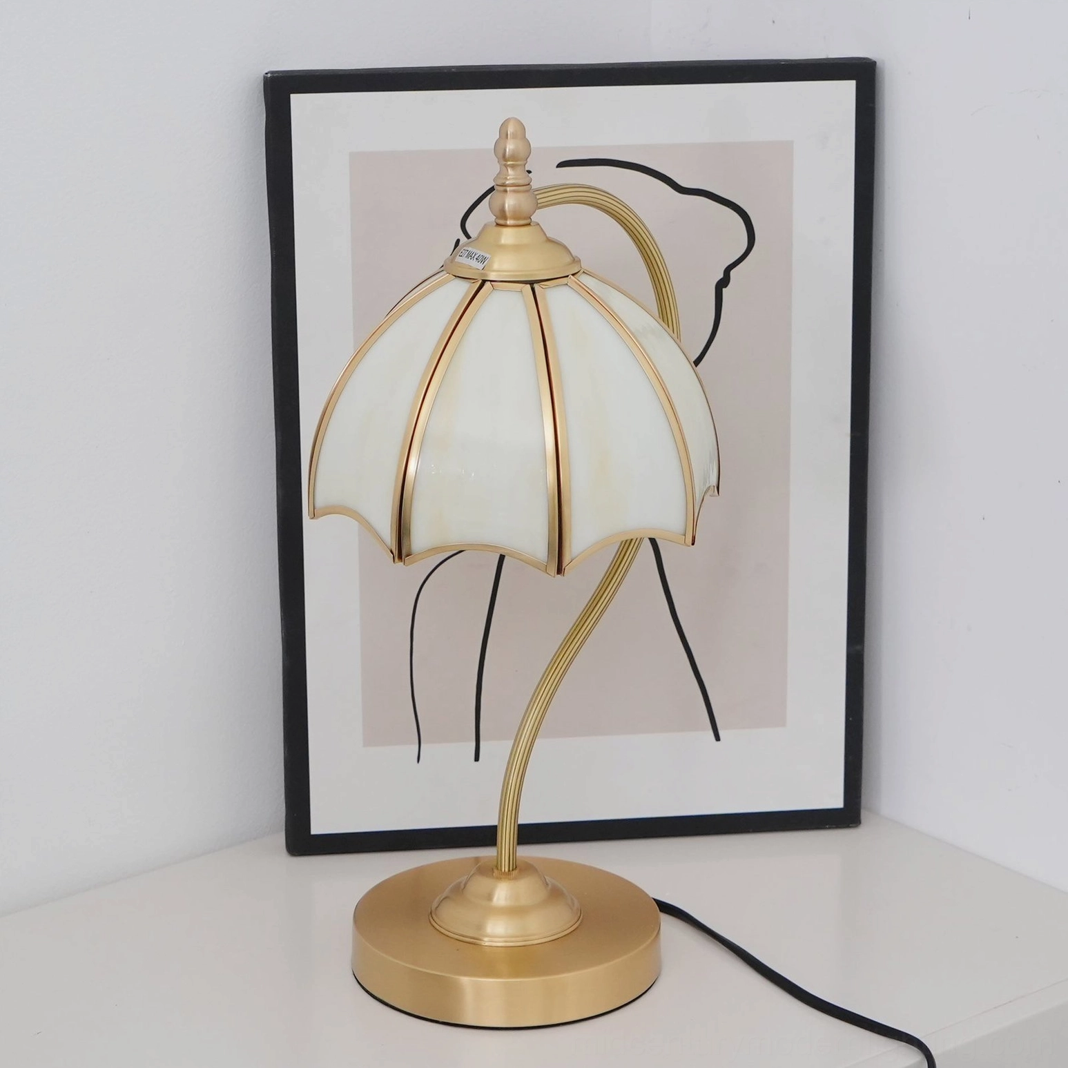 Premium frosted glass umbrella lamp on home office desk with warm brass finish