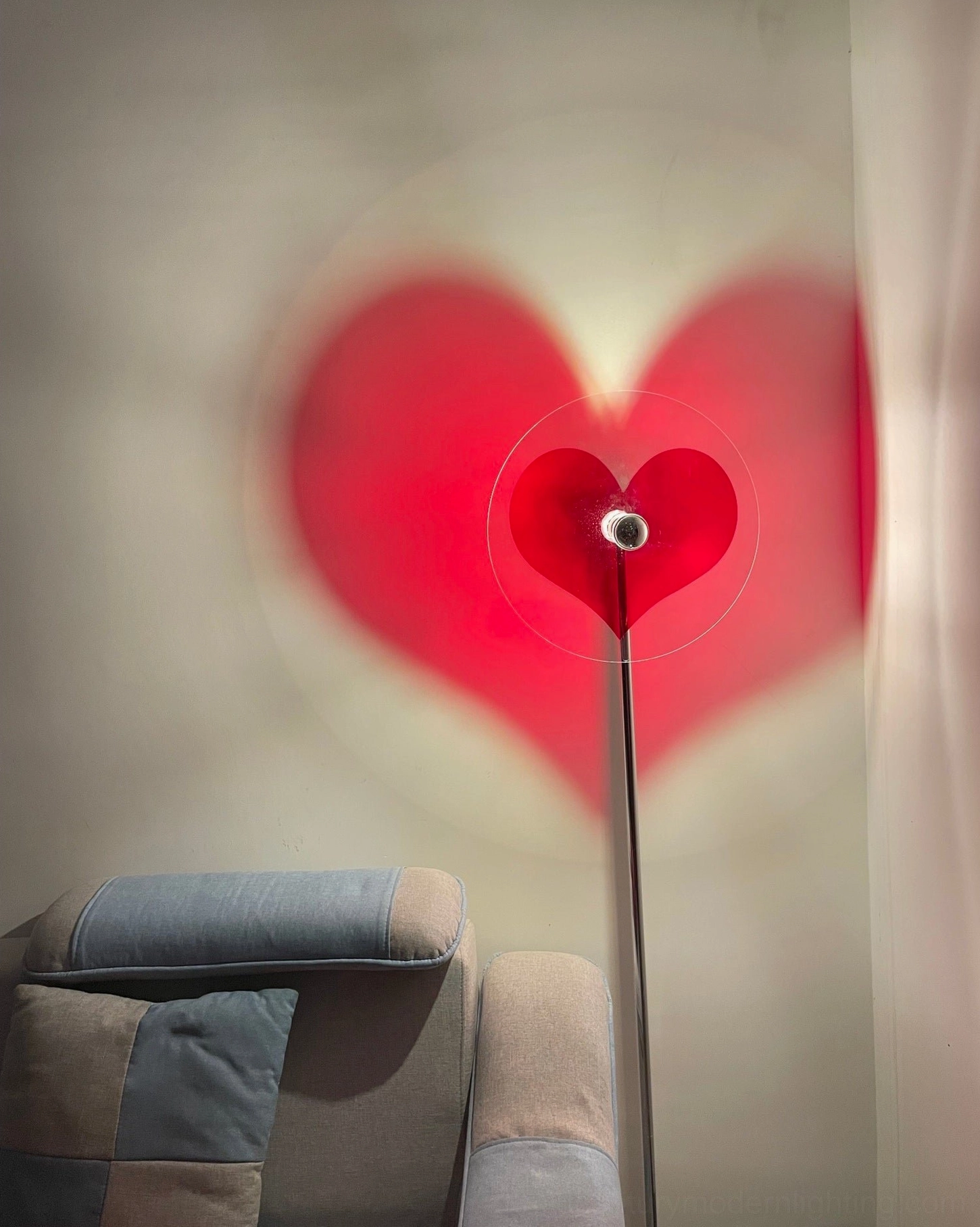 Red heart floor lamp featuring premium chrome construction and clear acrylic shade for modern homes