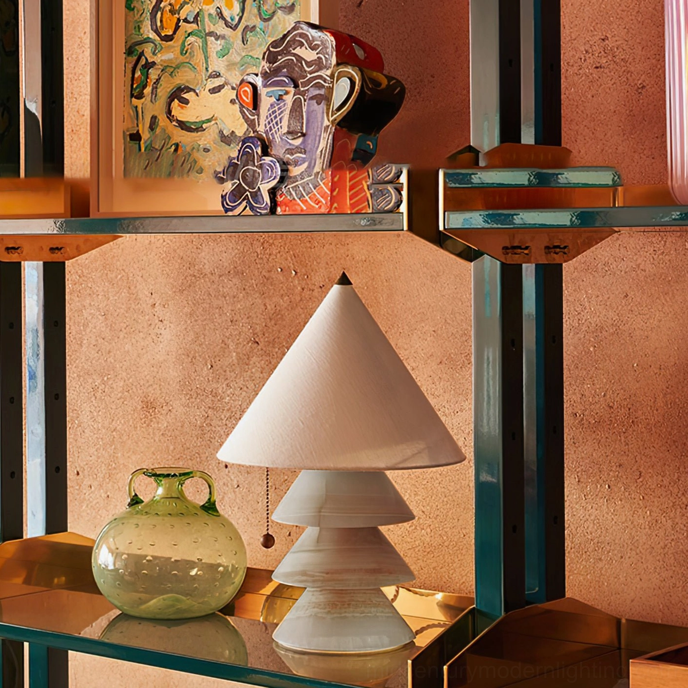 Multiple pyramid marble table lamps with mixed pink and white stone bases on marble factory showroom display
