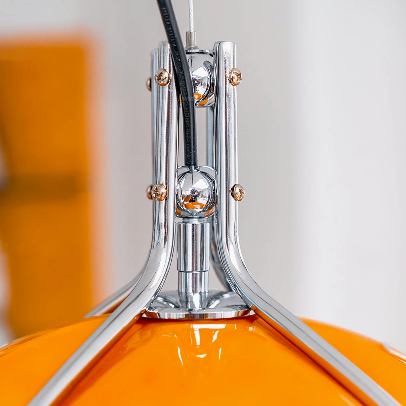Quadrifoglio pendant lamp suspension joint showing bolted chrome hardware and power cord