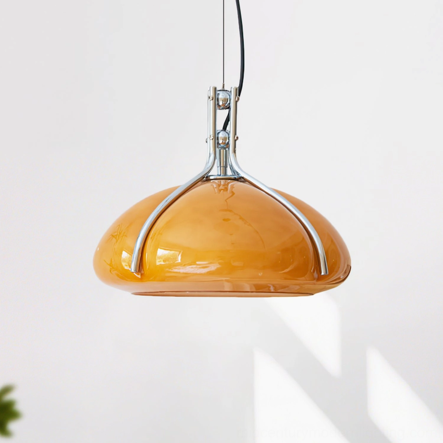 Mid-century modern Quadrifoglio pendant lighting overhead view showing polished chrome suspension