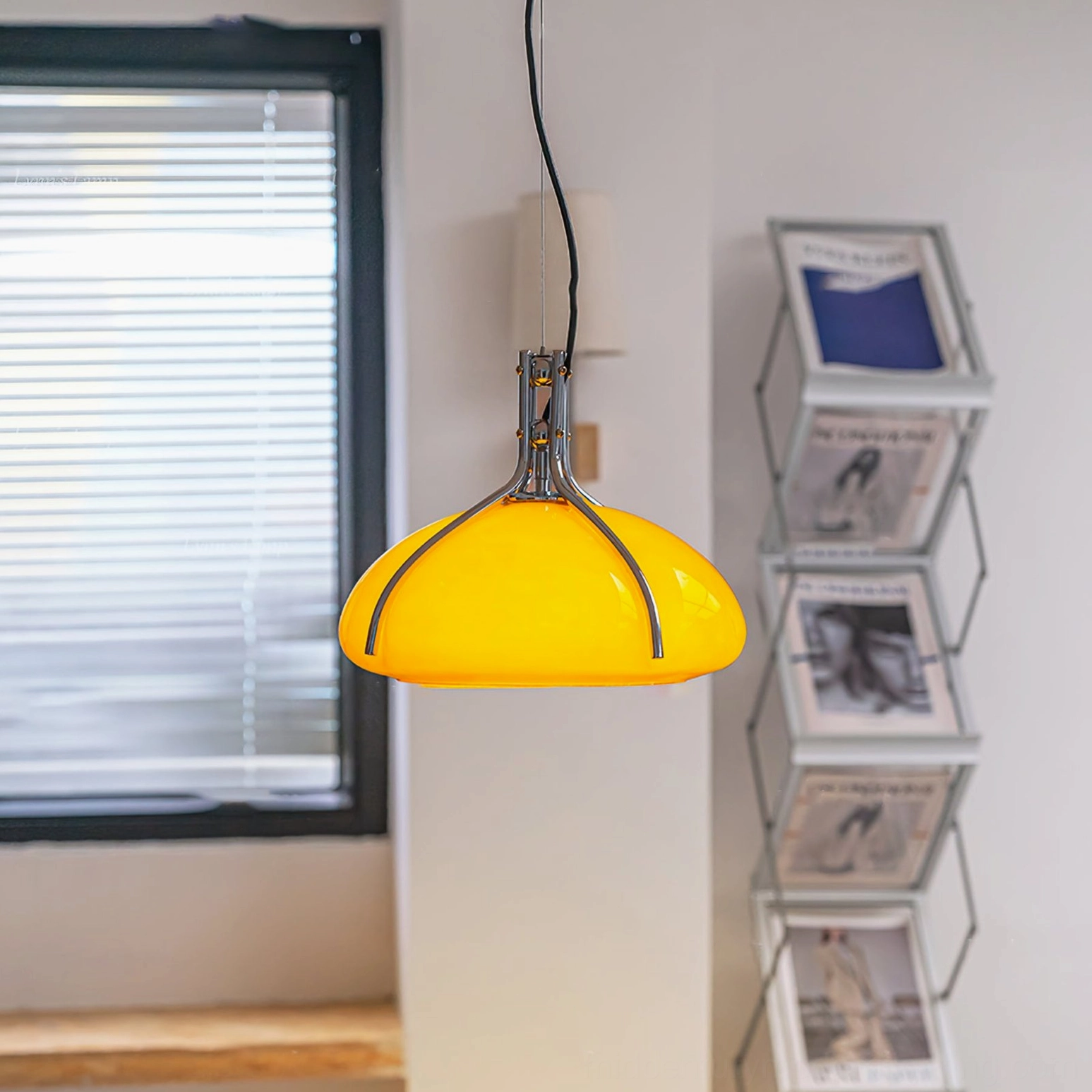 Quadrifoglio warm amber pendant lamp in cozy home interior with window light