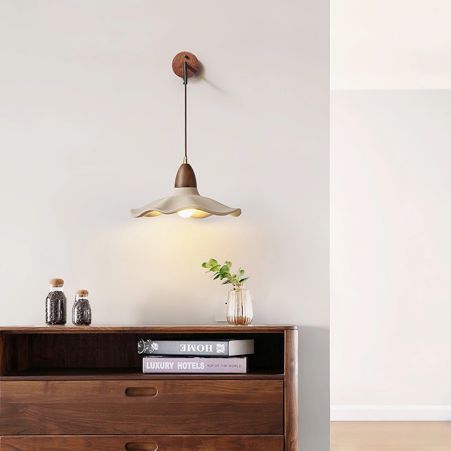 Radha modern wall lamp in living room above cabinet with Japandi minimalist style and neutral accessories