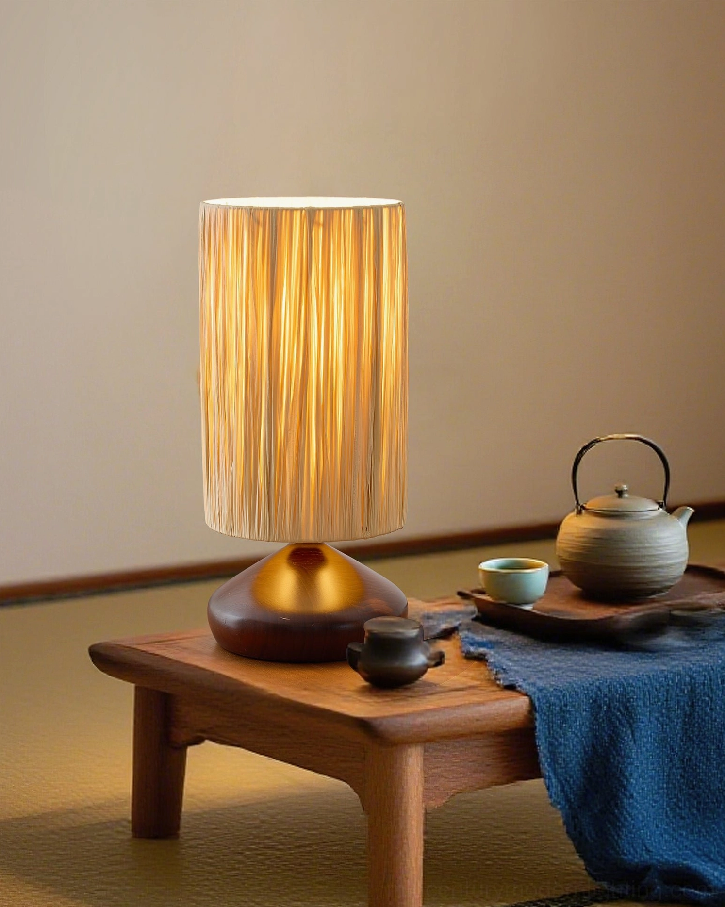 Lit woven raffia shade casting warm ambient light, tatami tea table setting with teapot, japandi interior