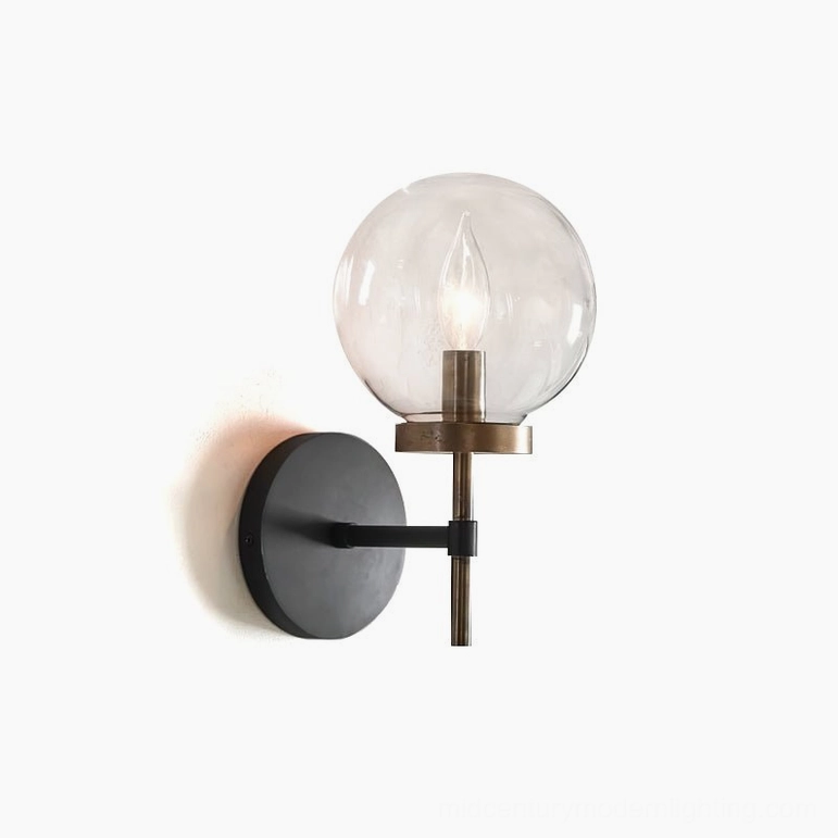 Ralbay modern globe wall sconce with warm industrial lighting, low angle shot showing spherical glass shade and metal construction