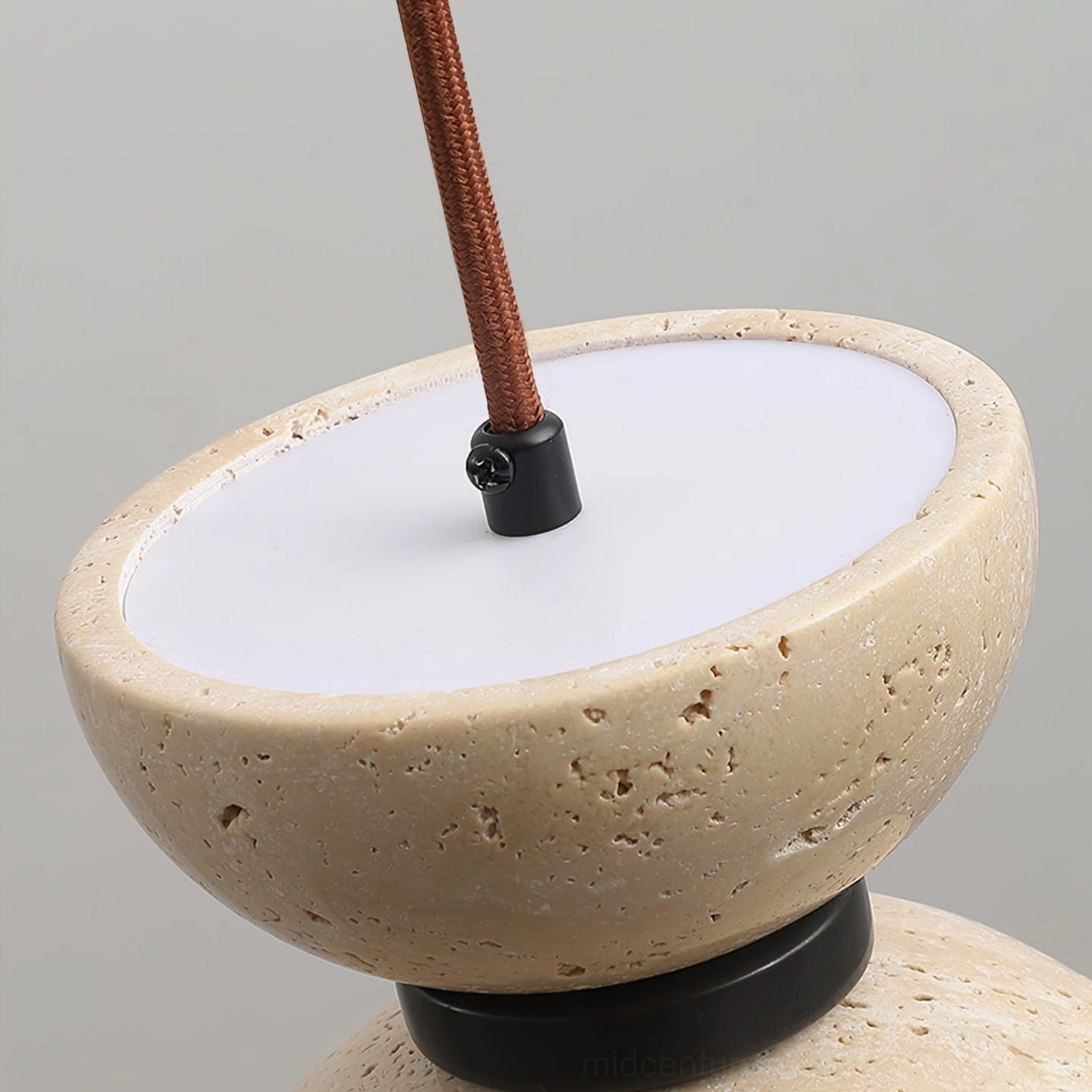 Interior view of Randolf pendant lamp showing white light diffuser and brown braided cord connector detail