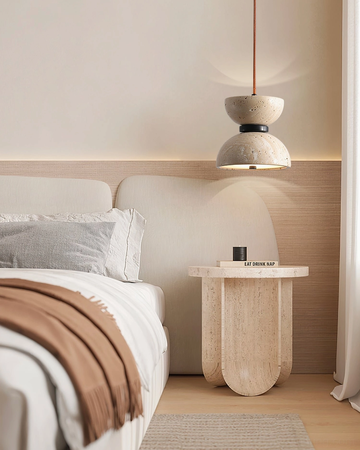 Randolf travertine pendant lamp in luxury minimalist bedroom with matching travertine side table and earthy wabi-sabi design