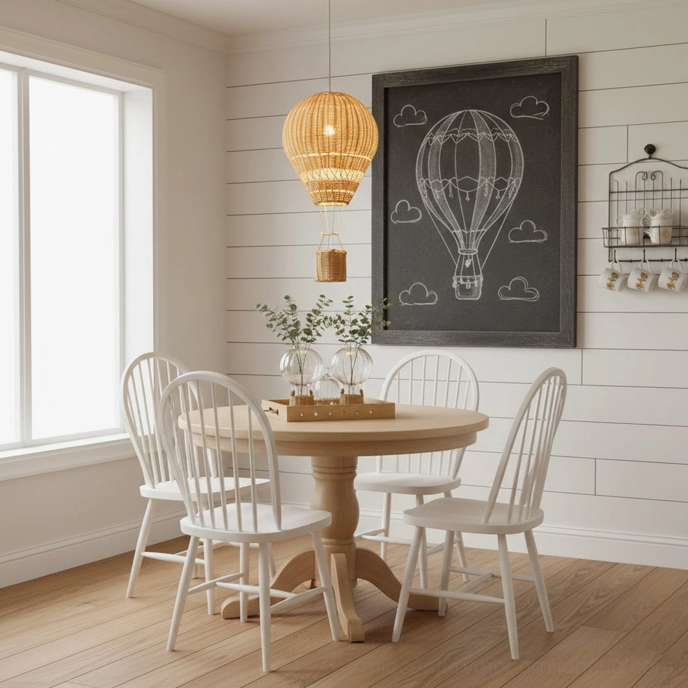 Rattan hot air balloon pendant light hung above wooden farmhouse dining table