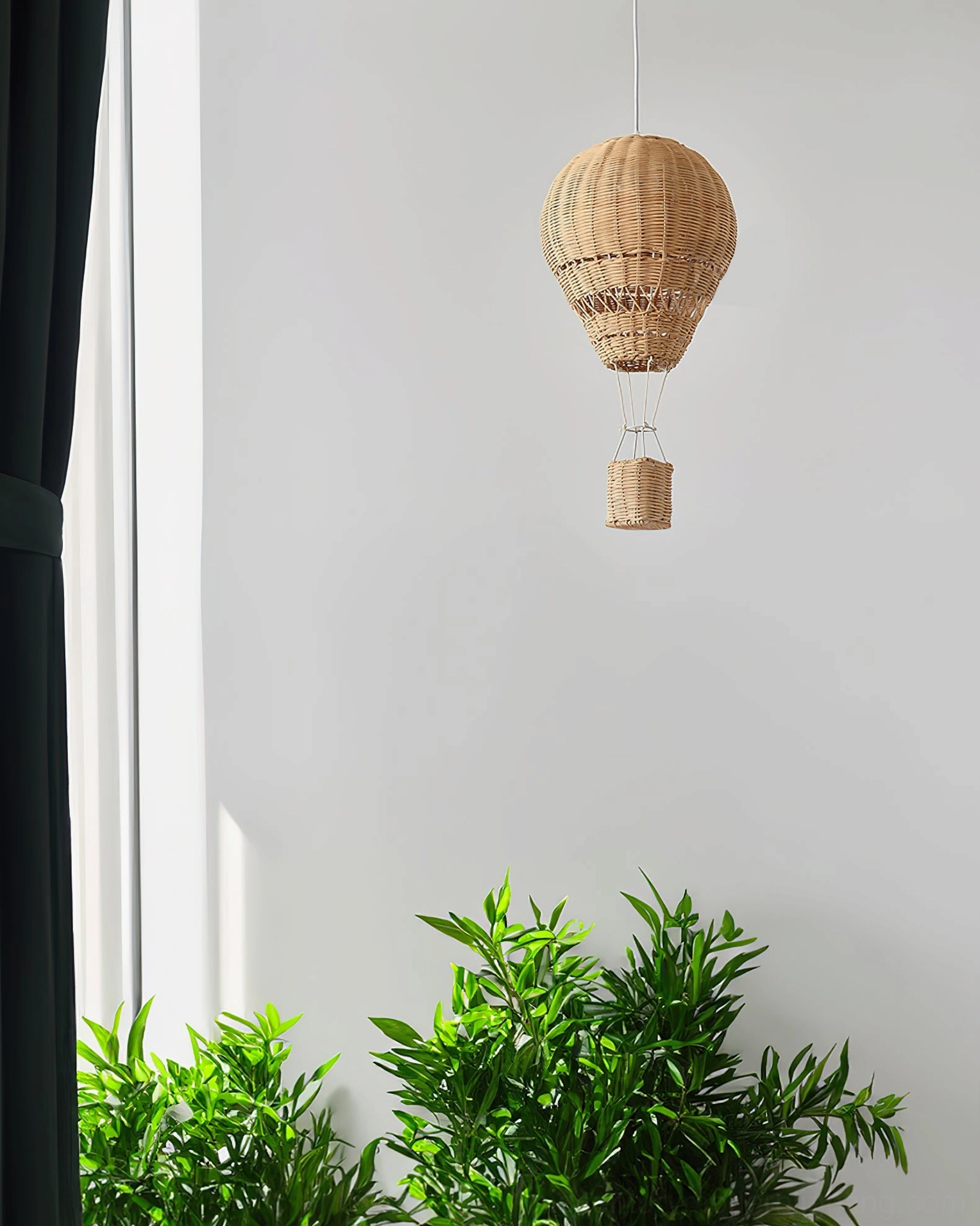 Natural woven rattan hot air balloon pendant as statement ceiling light in modern home