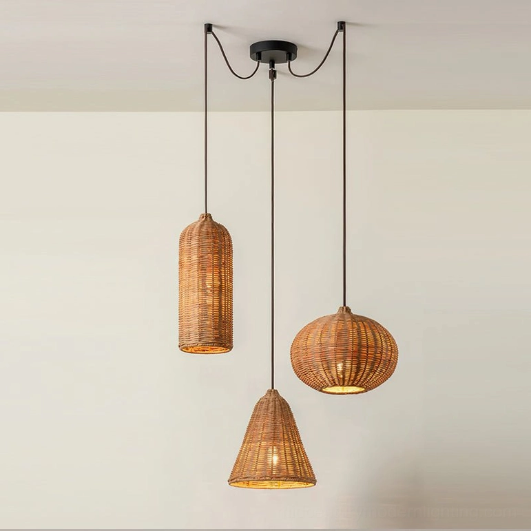 Three-shade rattan pendant light set with black ceiling mount and suspension cords, frontal studio shot highlighting geometric forms