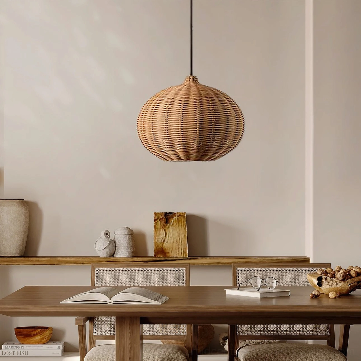 Rattan pendant light fixture showing hand-woven natural material detail and black metal framework construction