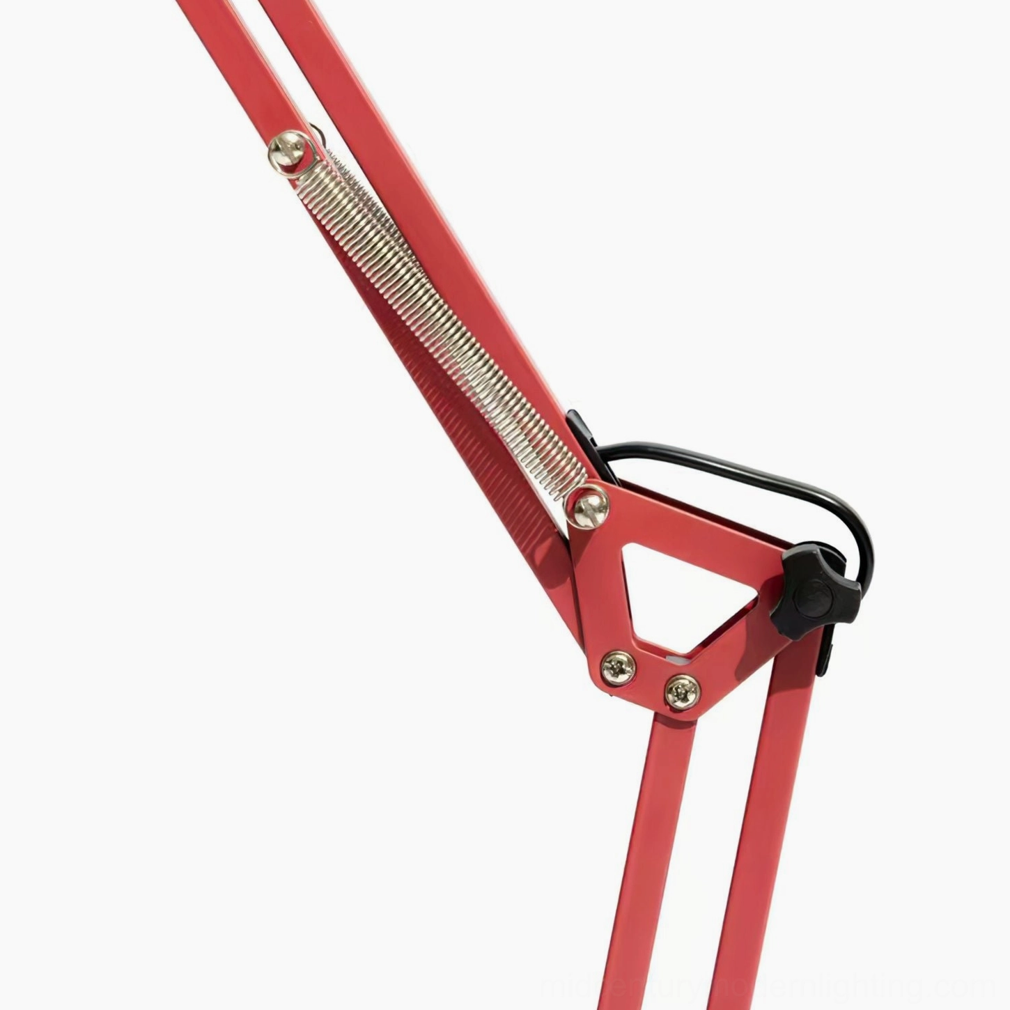 Red mid-century modern swing arm lamp detailed view showing articulated arm mechanism and base design