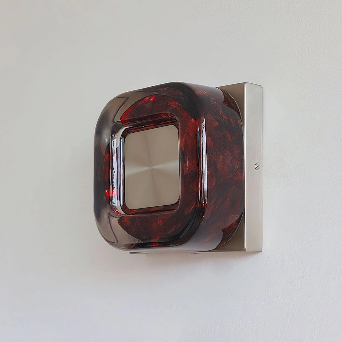 Red wall sconce installation in contemporary eclectic interior with vintage-modern styling
