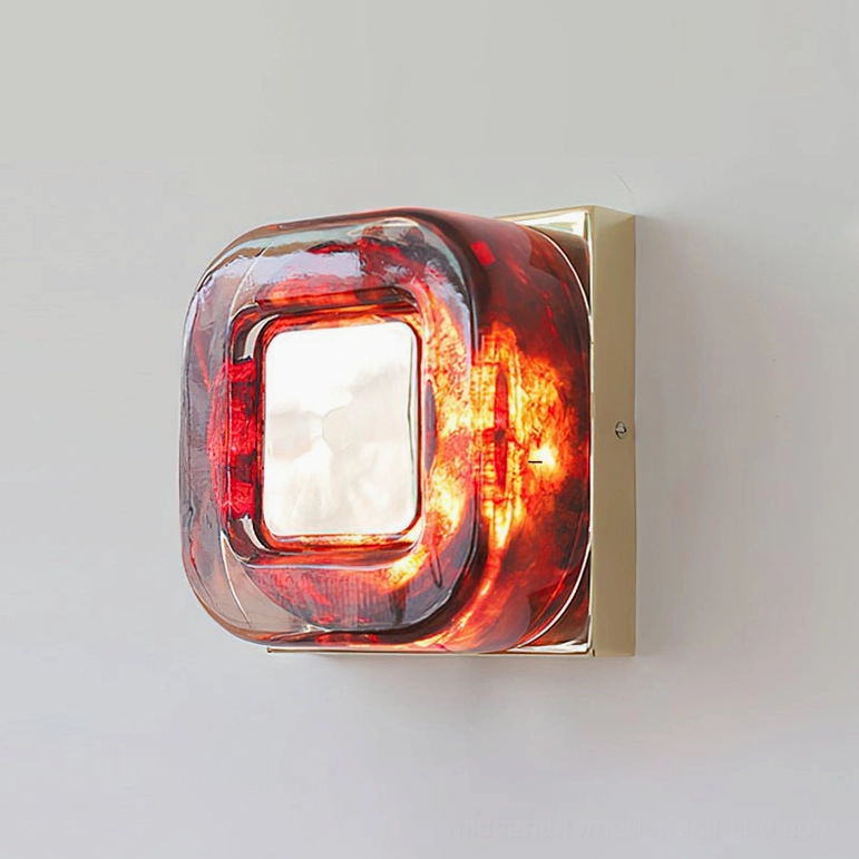 Red circular wall sconce with gold finish frame variant in luxury bedroom decor