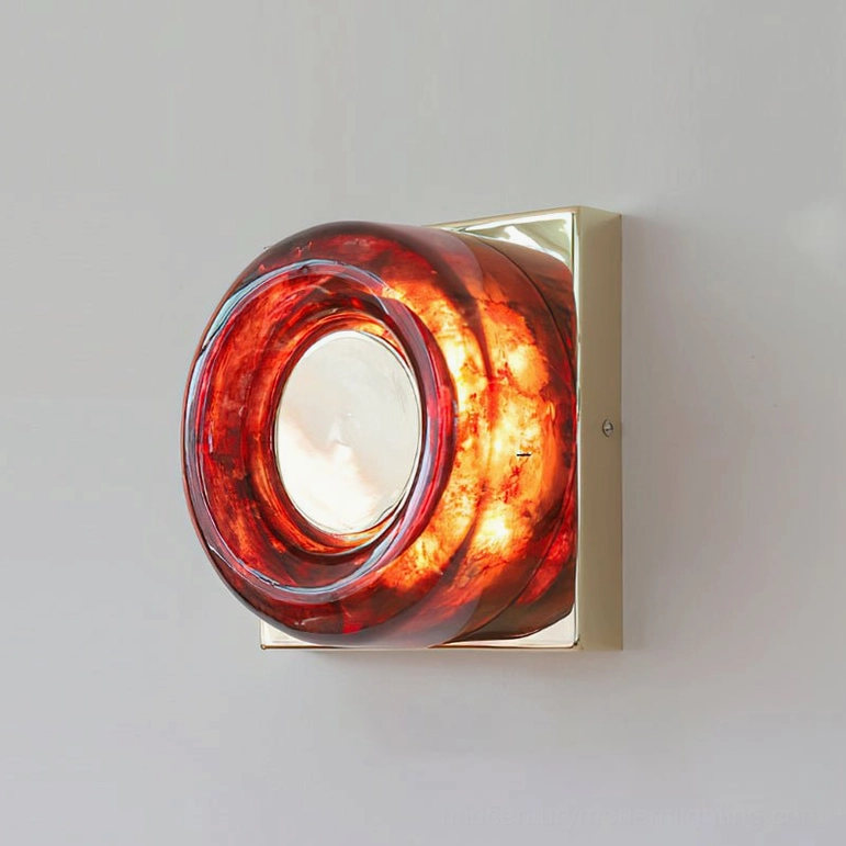 Red circular wall sconce model A variant with satin nickel frame in modern interior
