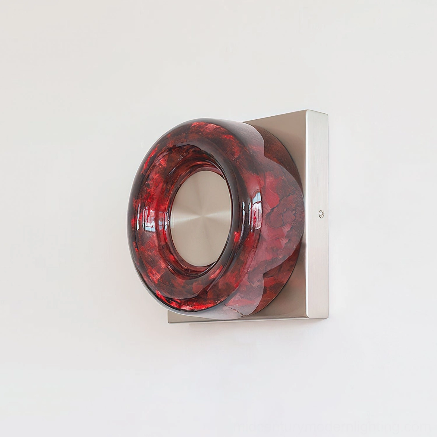Pair of red circular wall sconces creating symmetrical lighting arrangement in gallery-style entryway