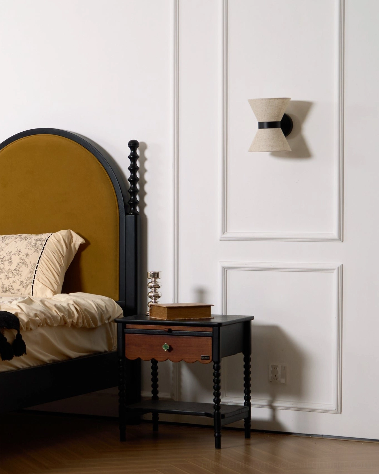 Renwick wall sconce in classic paneled bedroom with wainscot walls and dark wood nightstand
