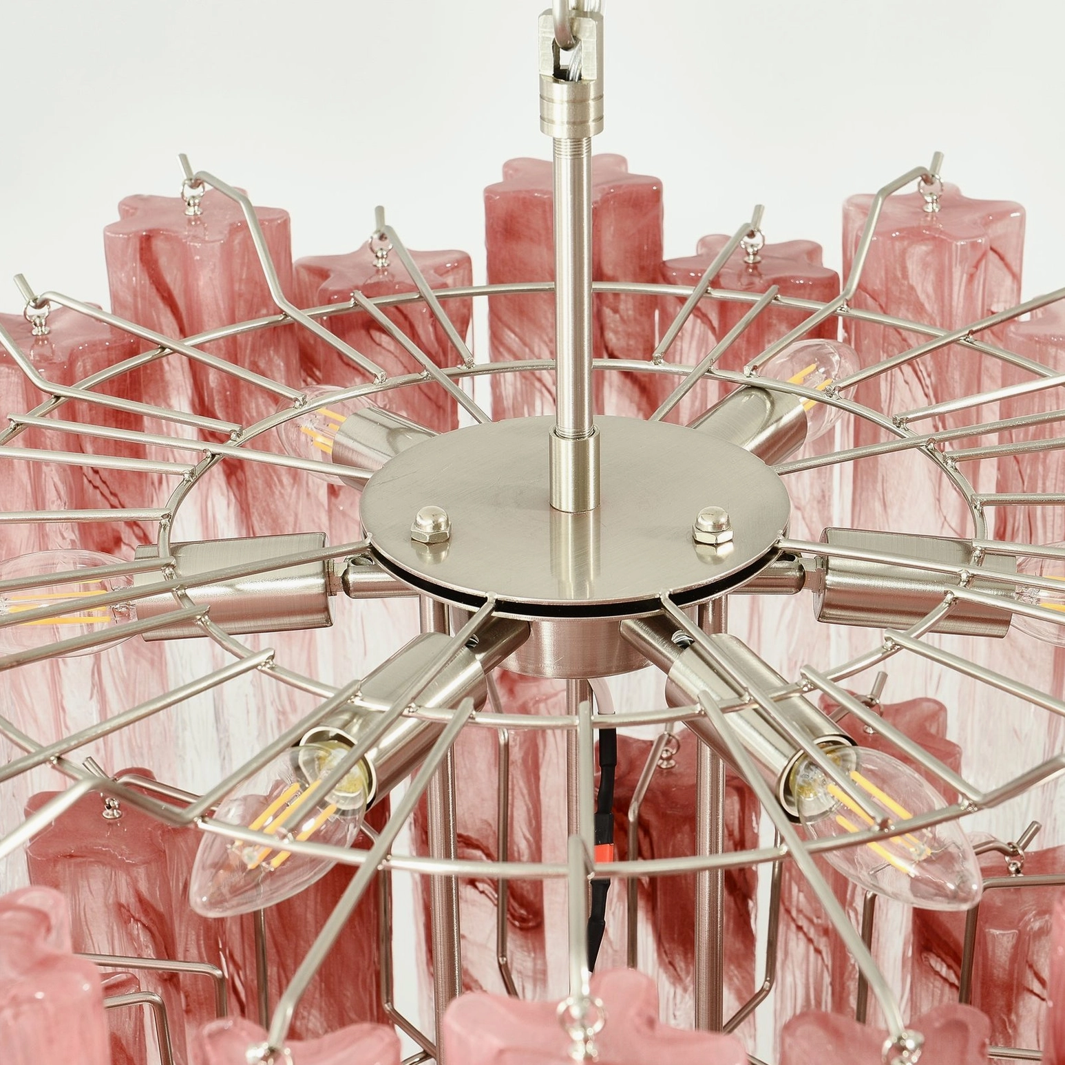 Pink Murano tube chandelier installed at ceiling height in residential interior space