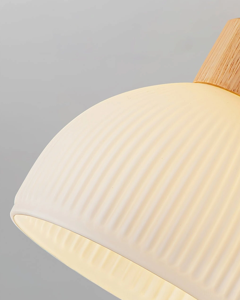Side view of ribbed white ceramic lampshade, showing vertical flute pattern and finish