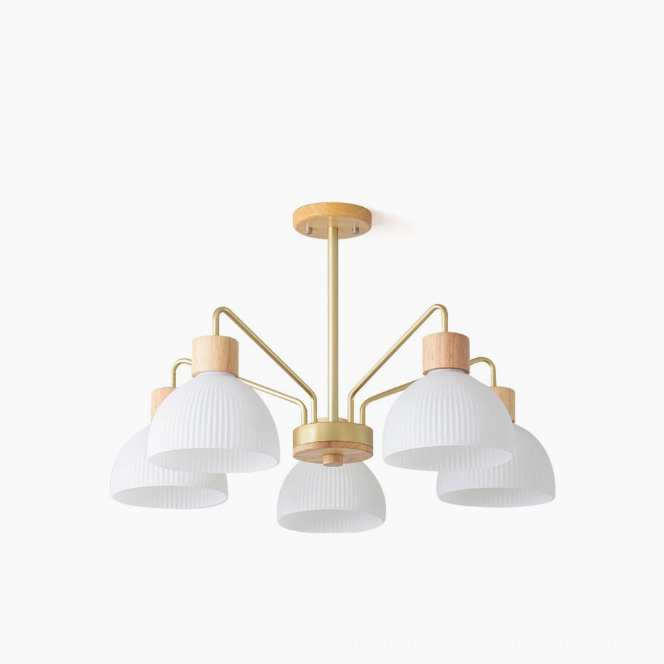 5-head ribbed glass chandelier with gold metal frame and pleated white glass shades, overhead studio view