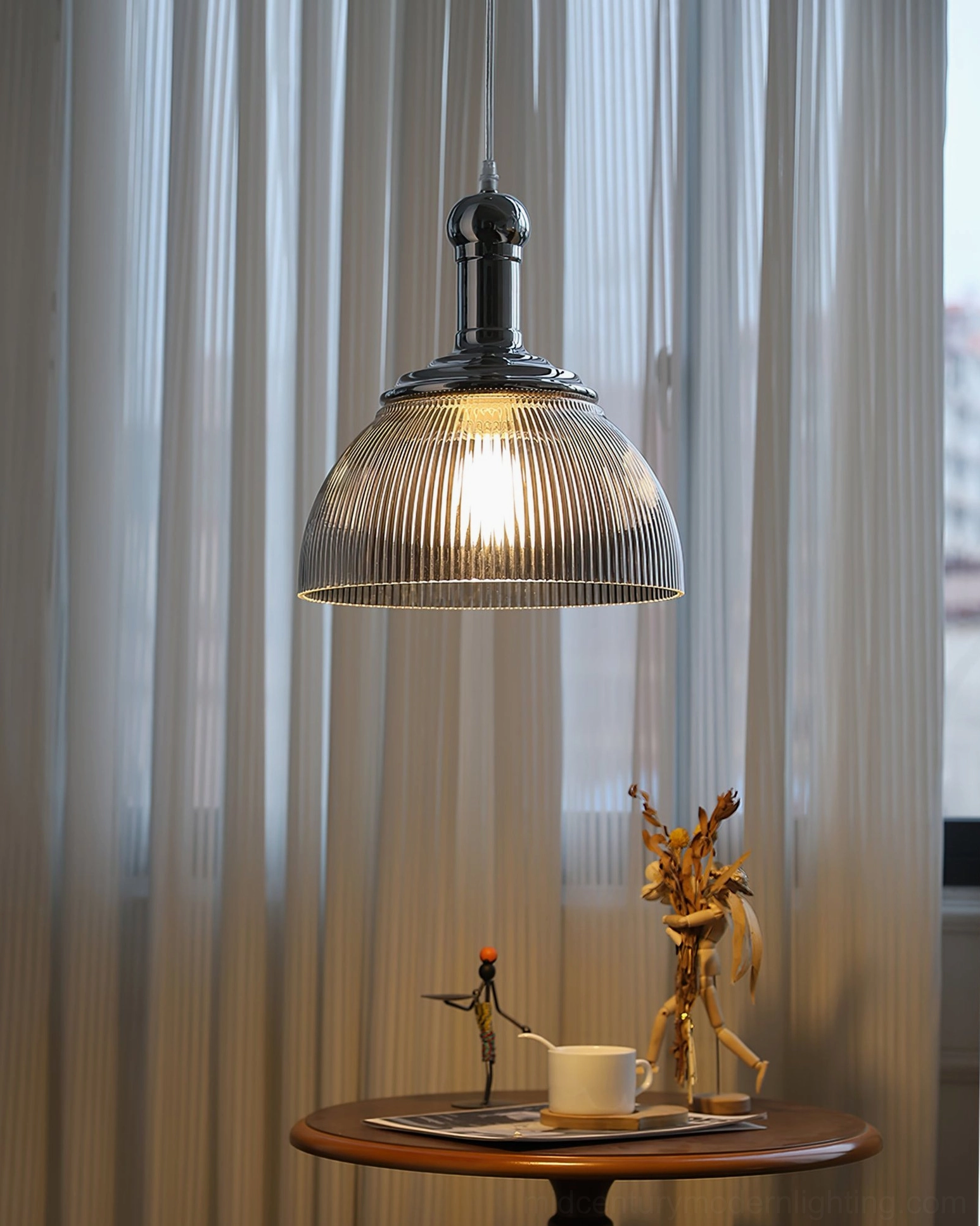 Ribbed glass pendant light showcasing warm ambient lighting for residential dining space